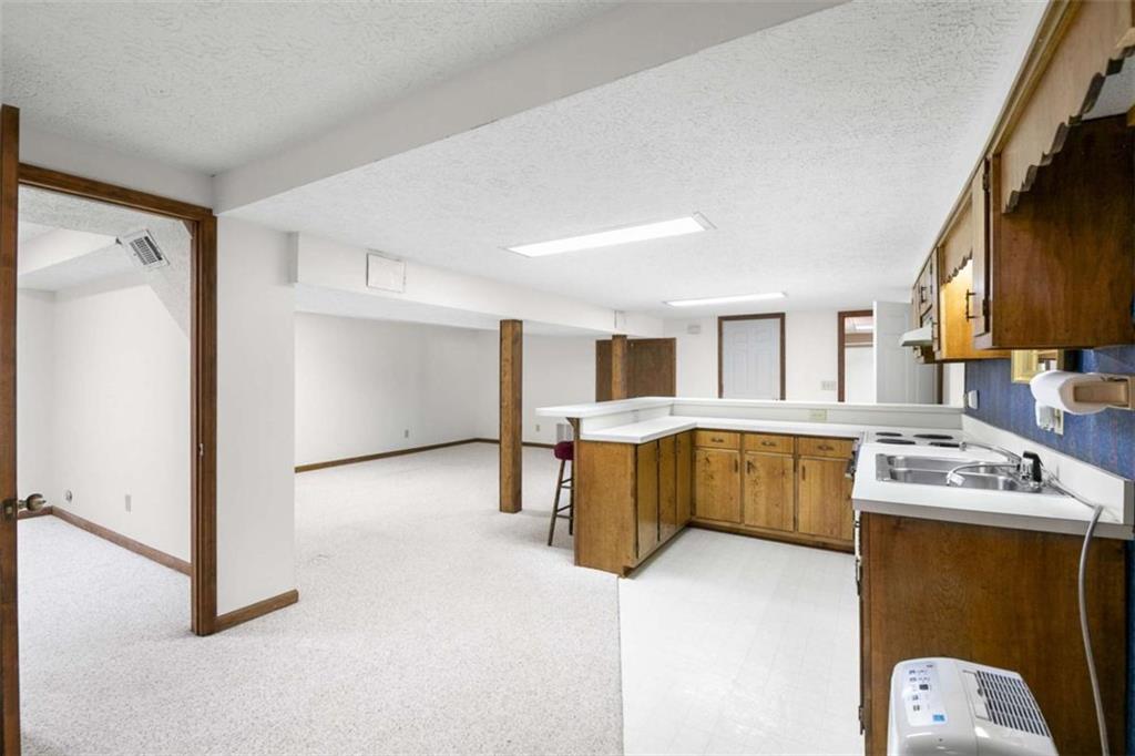 2678 North Bogan Road Northeast Buford, GA 30519 - Photo 21 of 52 a kitchen with a refrigerator and a stove