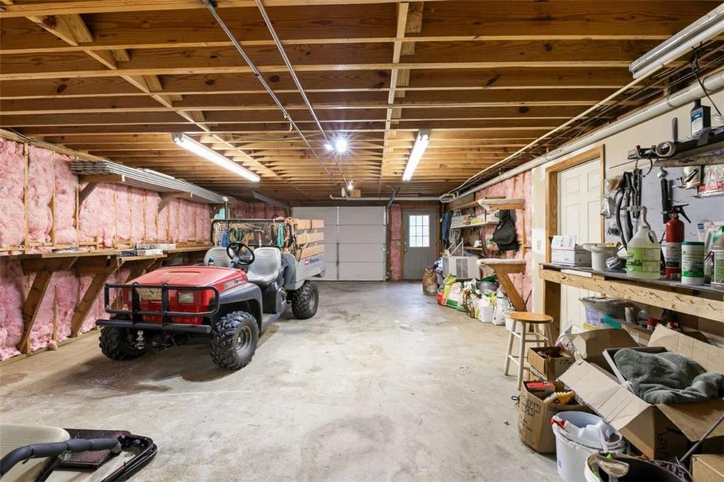 2678 North Bogan Road Northeast Buford, GA 30519 - Photo 27 of 52 a view of a garage with parked cars