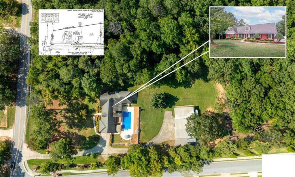 2678 North Bogan Road Northeast Buford, GA 30519 - Photo 28 of 52 an aerial view of residential houses with outdoor space and trees