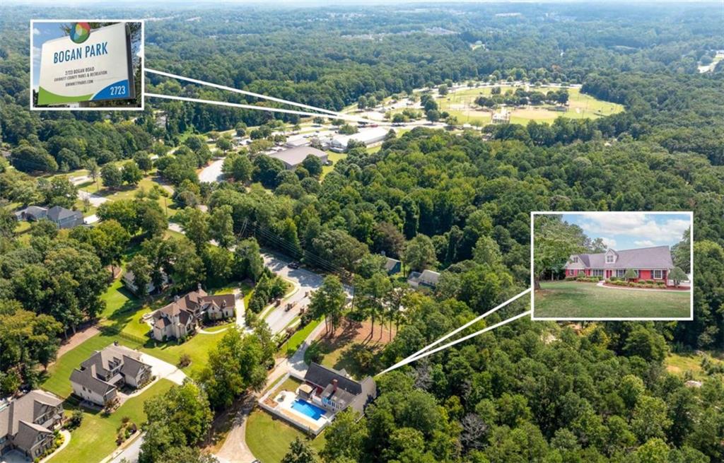 2678 North Bogan Road Northeast Buford, GA 30519 - Photo 3 of 52 an aerial view of a house with a yard and lake view