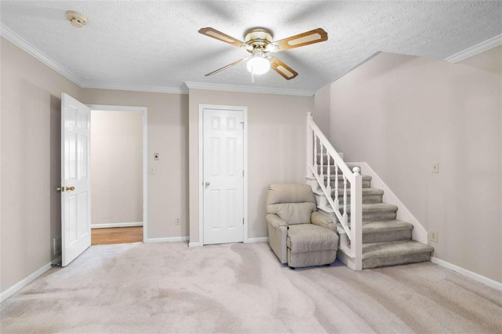 2678 North Bogan Road Northeast Buford, GA 30519 - Photo 32 of 52 a view of entryway and hall with a chandelier