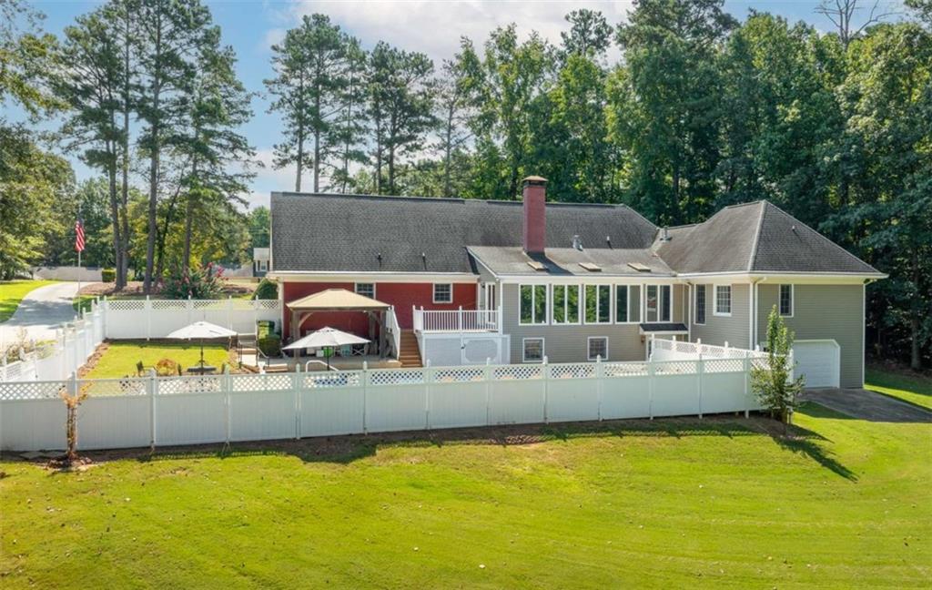2678 North Bogan Road Northeast Buford, GA 30519 - Photo 43 of 52 a view of a house with swimming pool and sitting area