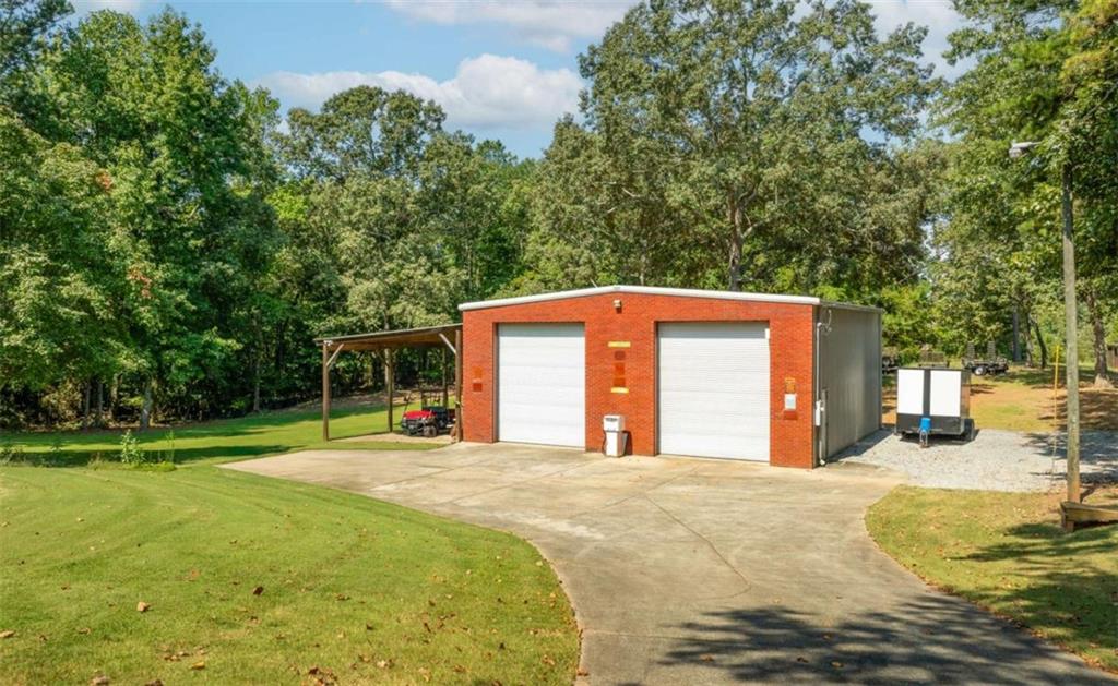 2678 North Bogan Road Northeast Buford, GA 30519 - Photo 45 of 52 a view of a house with a outdoor space