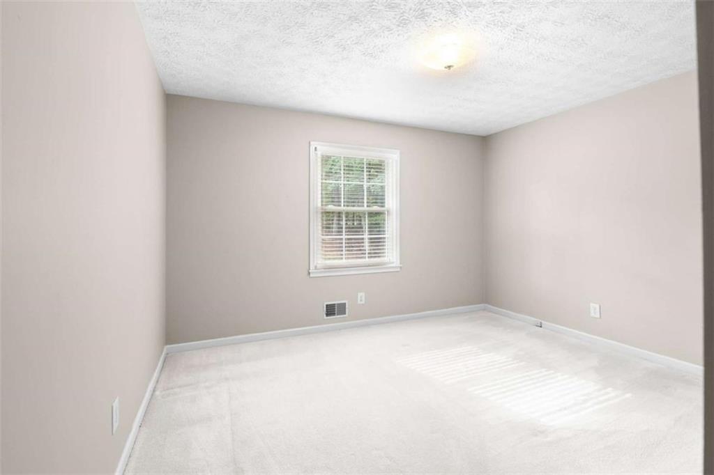 2678 North Bogan Road Northeast Buford, GA 30519 - Photo 51 of 52 a view of an empty room with a window