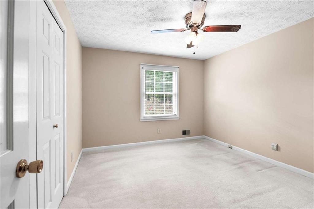 2678 North Bogan Road Northeast Buford, GA 30519 - Photo 52 of 52 a view of an empty room with a window