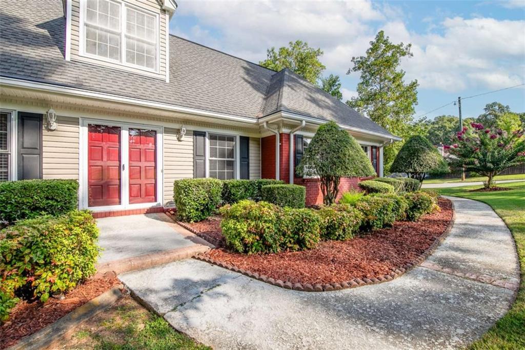 2678 North Bogan Road Northeast Buford, GA 30519 - Photo 9 of 52 front view of a house with a yard