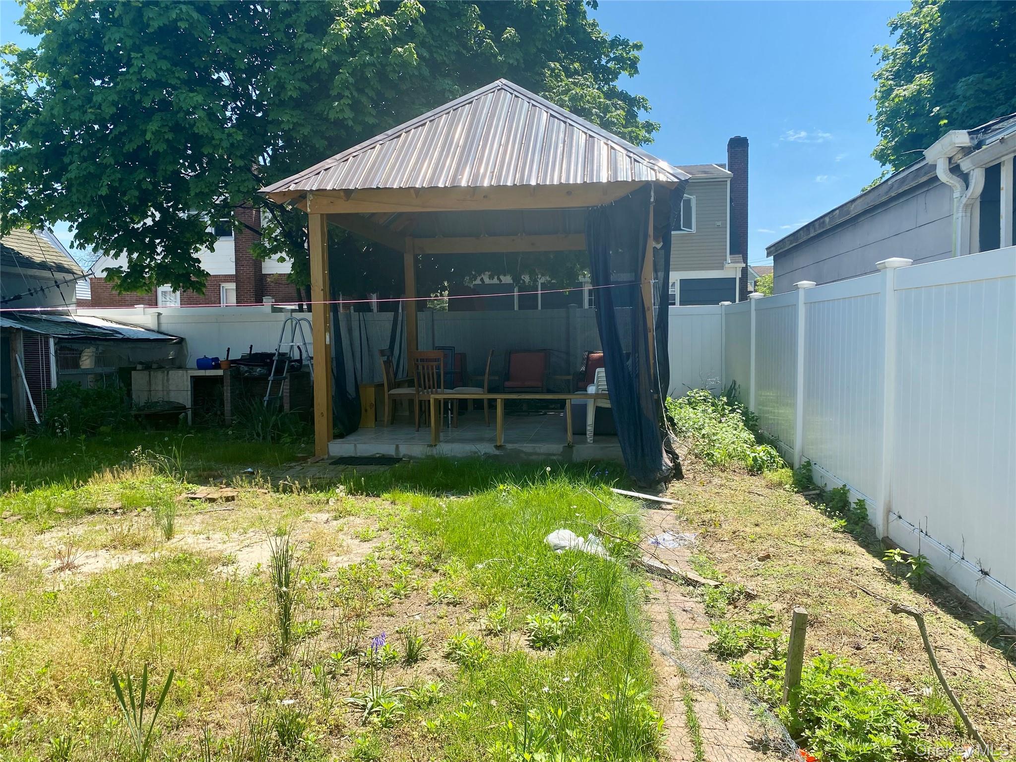 204 Beech Street Valley Stream, NY 11580 - Photo 14 of 18 a view of an house with backyard space and garden