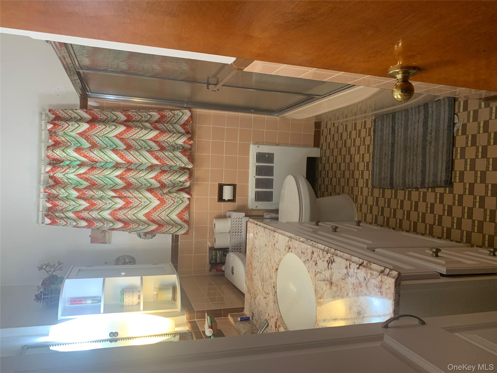 204 Beech Street Valley Stream, NY 11580 - Photo 17 of 18 a bathroom with a granite countertop sink and a mirror