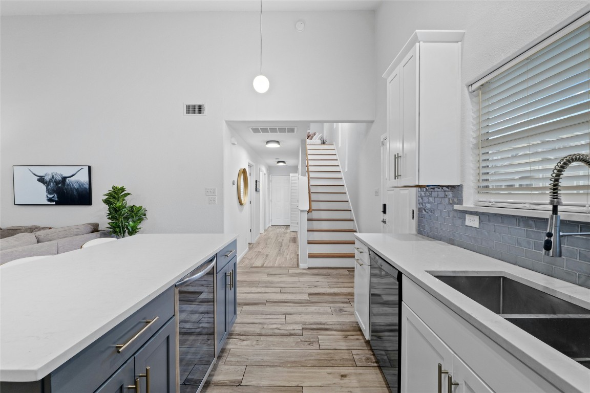a kitchen with a sink and stove