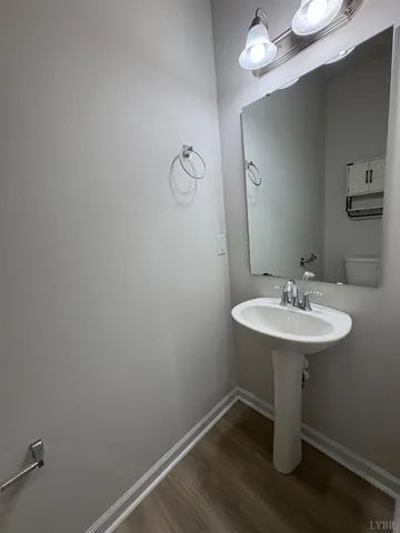 a bathroom with a sink a mirror and vanity