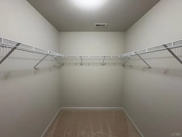 a view of a room with racks on the wall