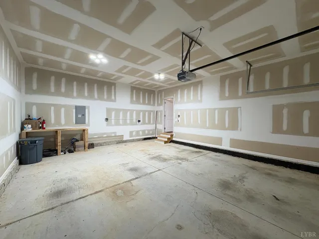 a view of an empty room with a ceiling fan