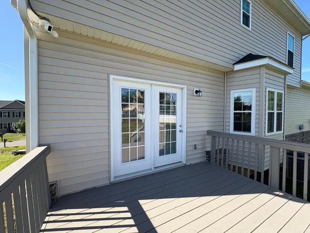 a view of a balcony with two chairs