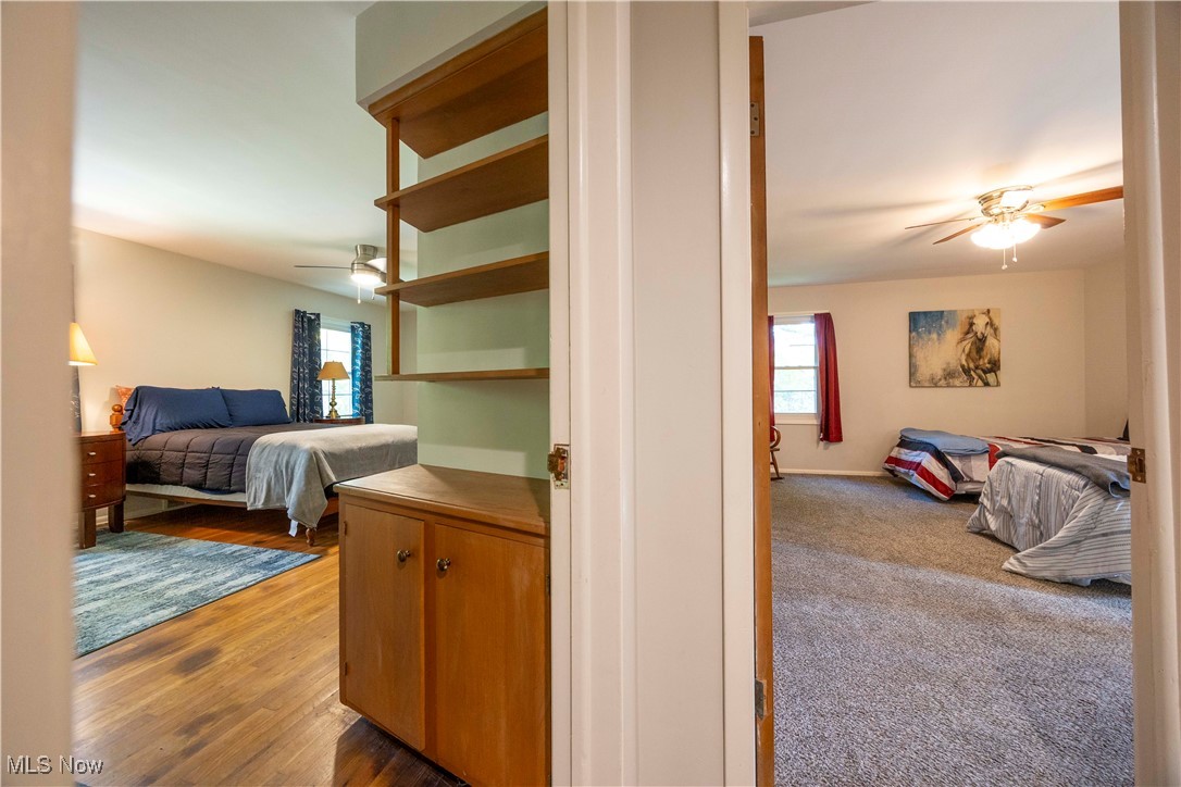 15724 Wyatt Road Cleveland, OH 44112 - Photo 27 of 47 Bedroom with ceiling fan, carpet floors, and wood finished floors