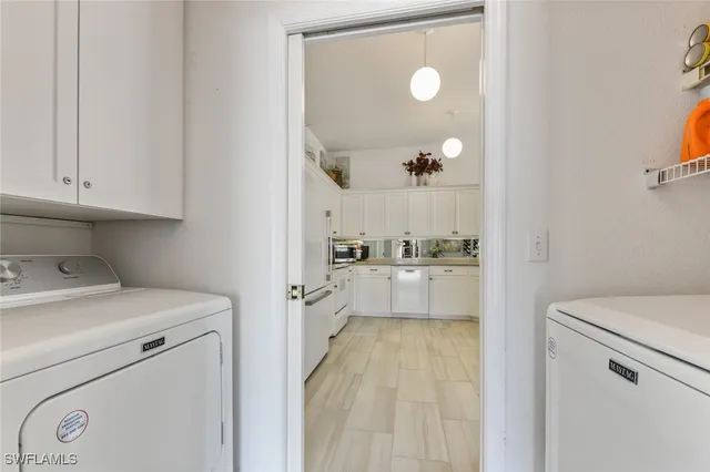 a view of storage and utility room with washer and dryer