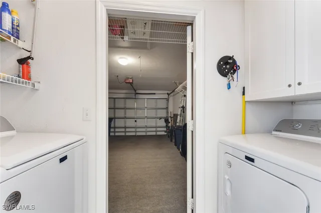 a view of storage and utility room with washer and dryer