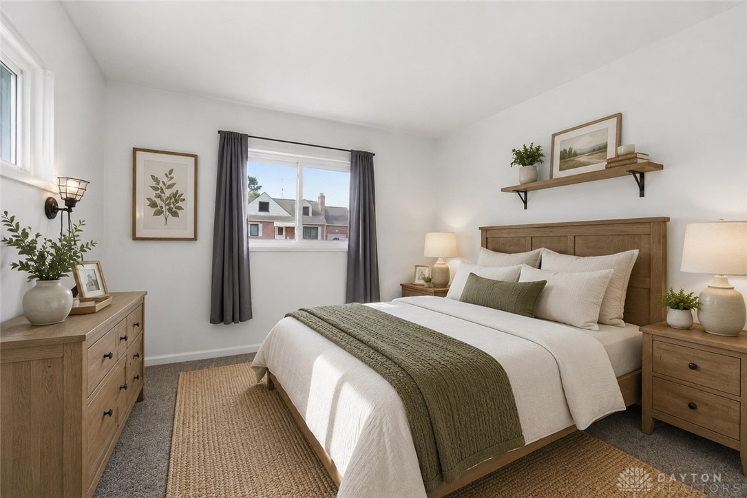 629 Storms Road Dayton, OH 45429 - Photo 6 of 51 This bright bedroom features ample natural light, soft carpeting, and a cozy atmosphere perfect for unwinding.