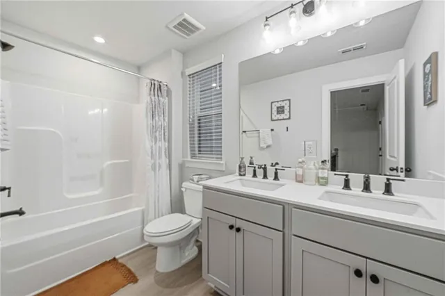 an aerial view of a house with swimming pool and furniture