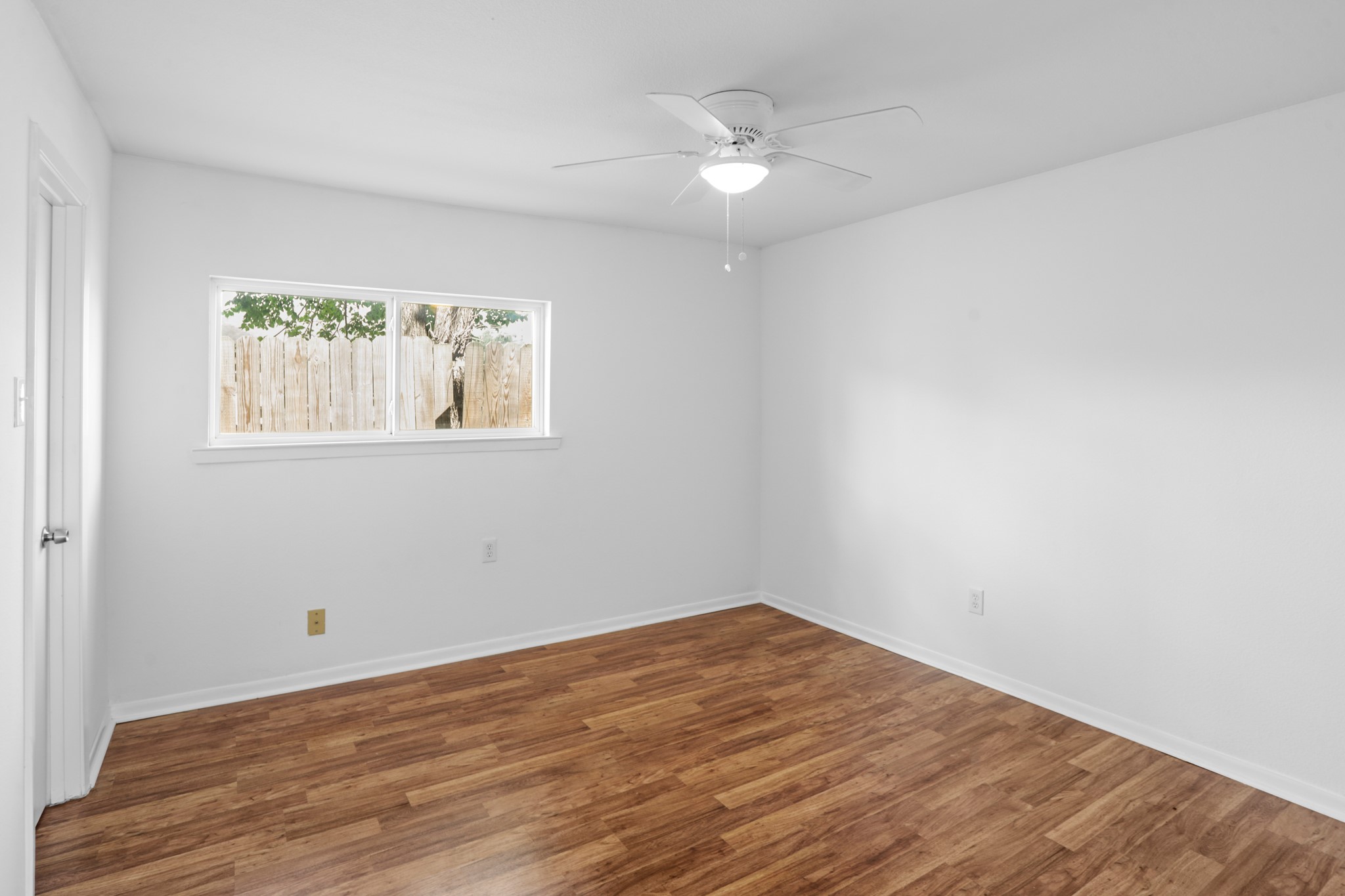 1408 Hughes Street, Unit 4 Houston, TX 77023 - Photo 22 of 27 Notice the recently updated bedroom double paned window and ceiling fan for cool sleeping.