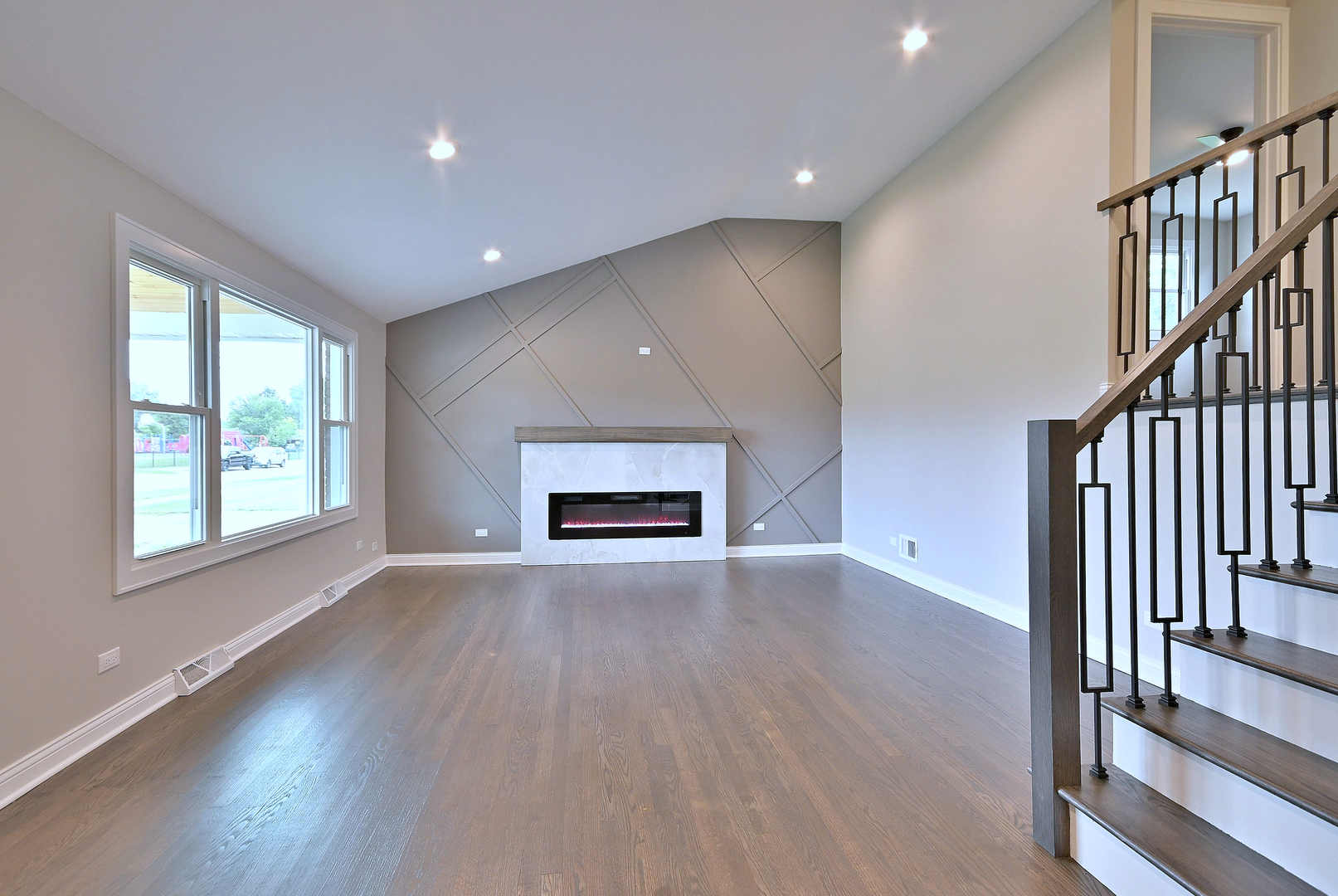 8218 Linder Avenue Burbank, IL 60459 - Photo 5 of 23 an empty room with wooden floor and windows