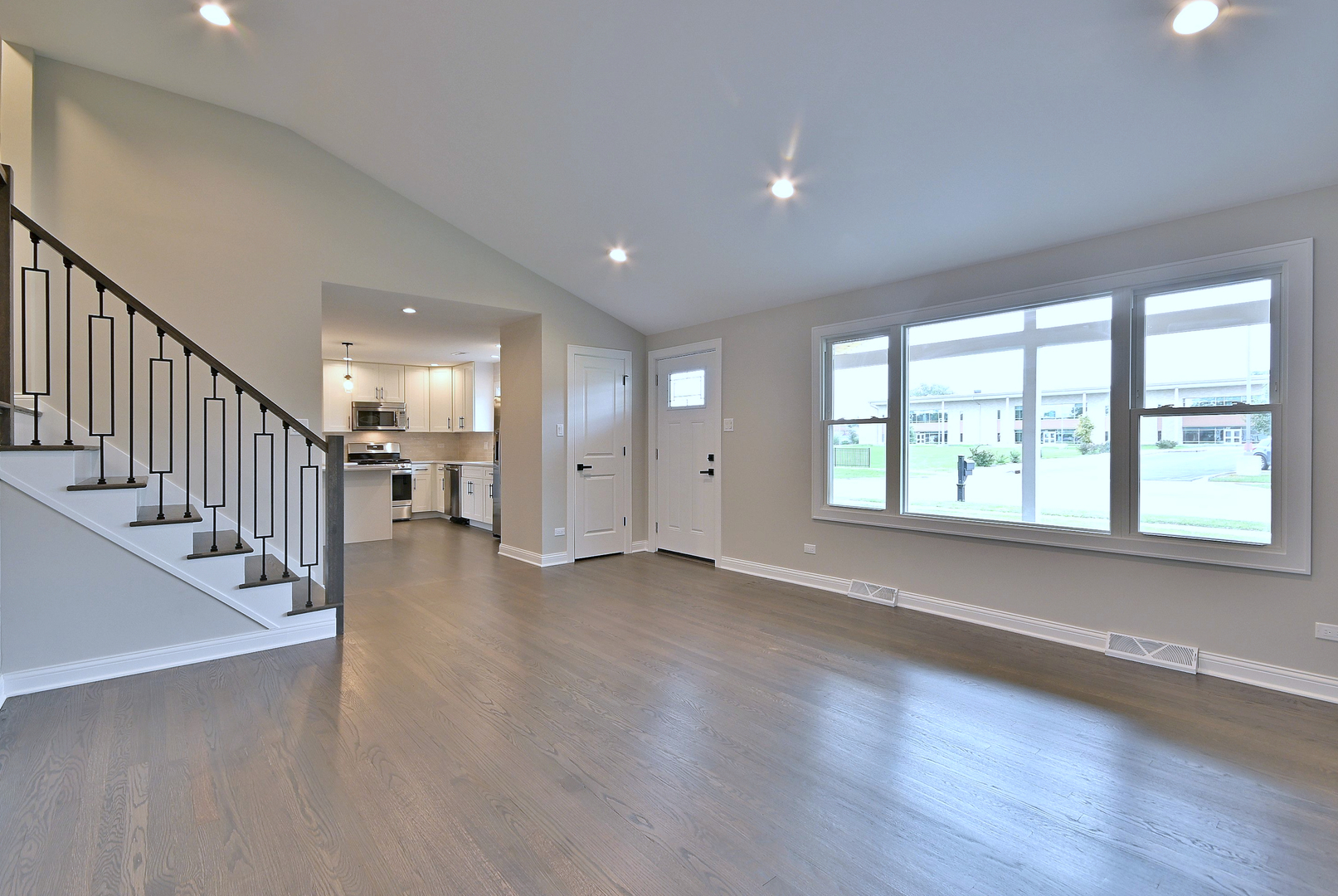 8218 Linder Avenue Burbank, IL 60459 - Photo 7 of 23 an empty room with wooden floor and windows