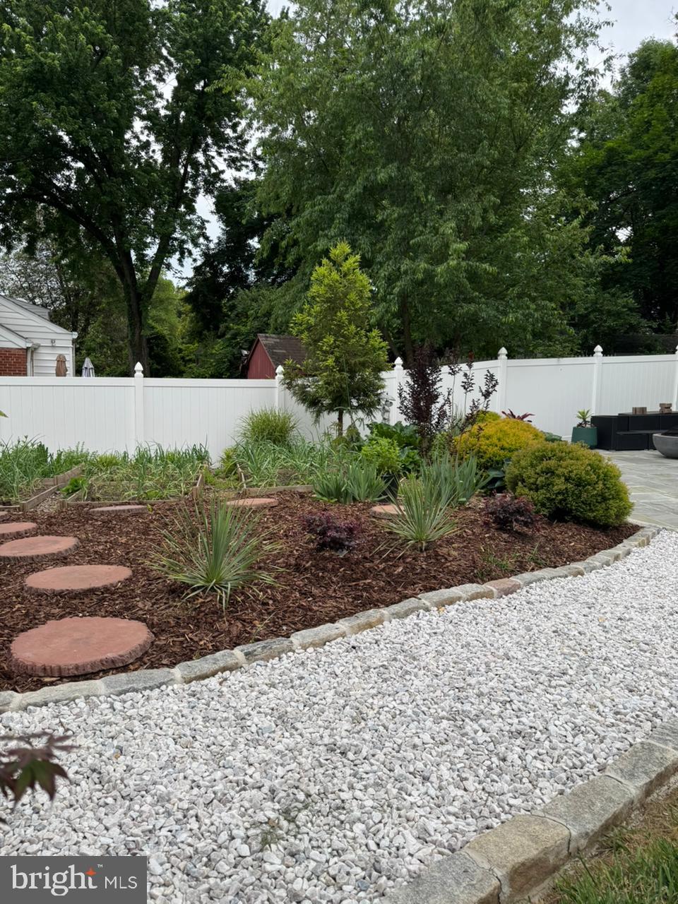 9006 Linton Street Silver Spring, MD 20901 - Photo 17 of 17 a view of a yard with plants and large trees
