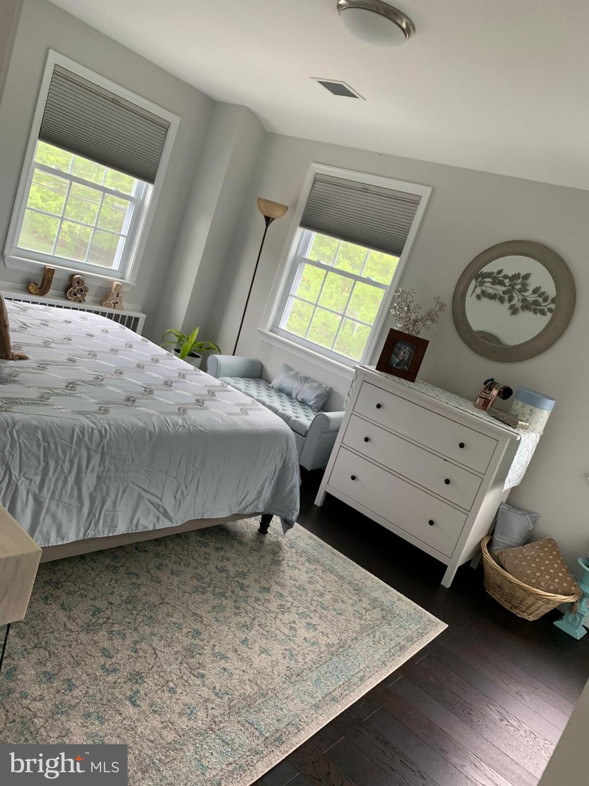 9006 Linton Street Silver Spring, MD 20901 - Photo 6 of 17 a bedroom with a bed and a table