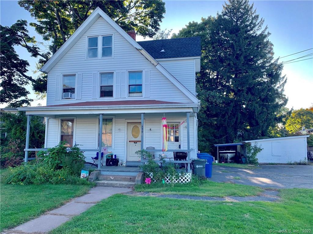 250 Main Street Manchester, CT 06042 - Photo 1 of 1 a view of a house with a yard and a garden