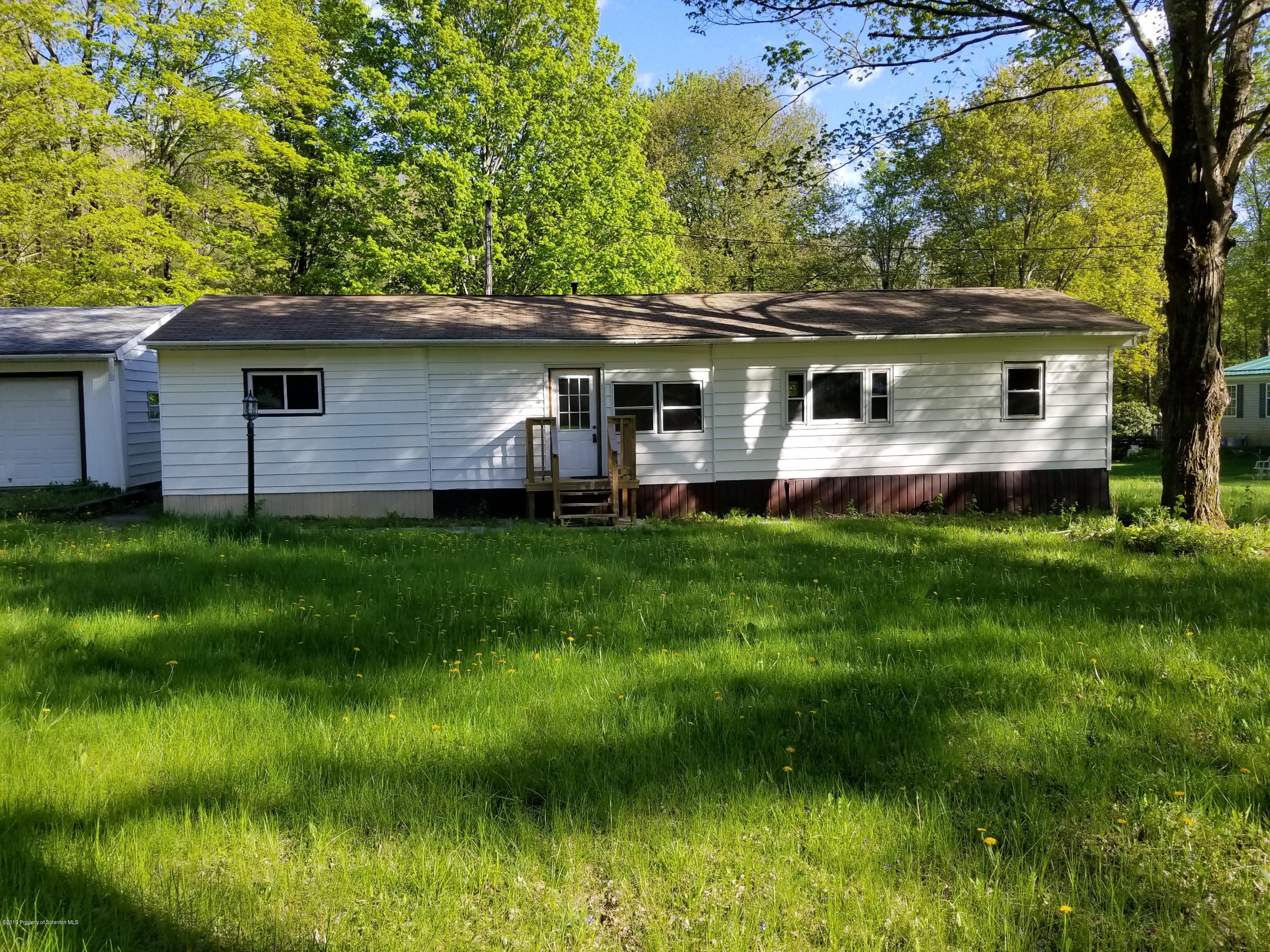 268 State Rte 4013 Little Meadows, PA 18830 - Photo 1 of 48 a front view of house with yard and green space