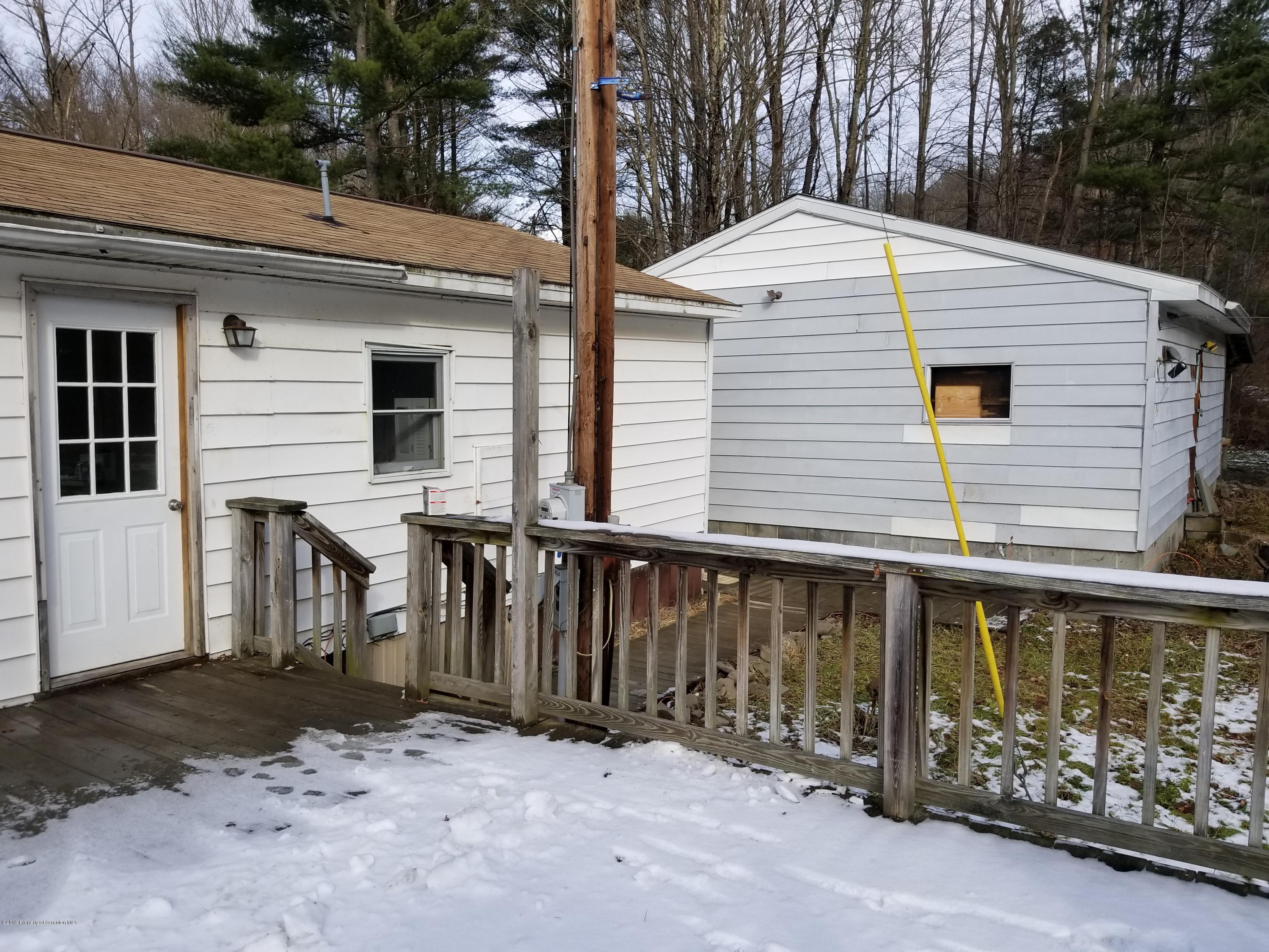 268 State Rte 4013 Little Meadows, PA 18830 - Photo 20 of 48 a front view of a house with garage