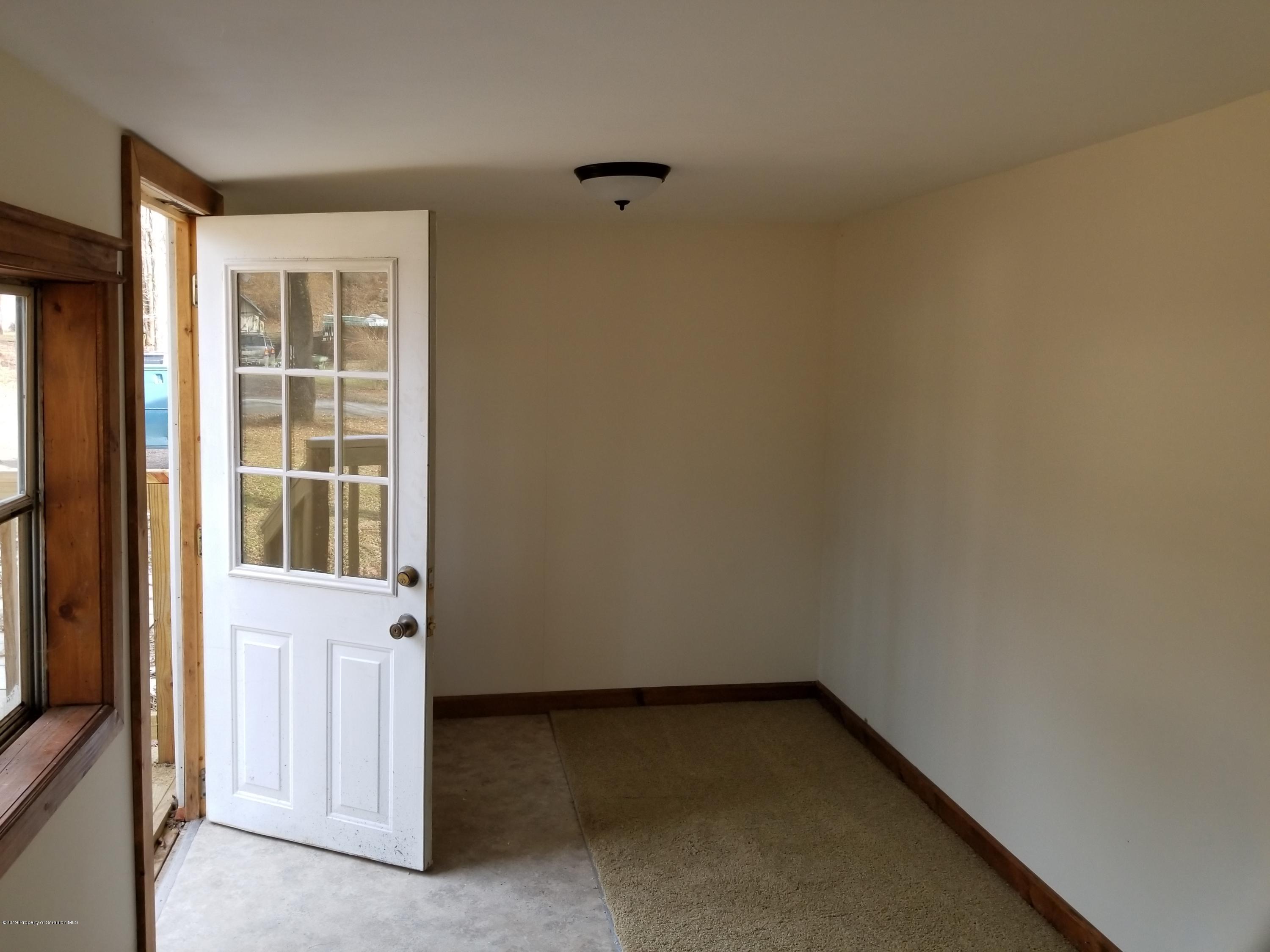 268 State Rte 4013 Little Meadows, PA 18830 - Photo 27 of 48 an empty room with a window