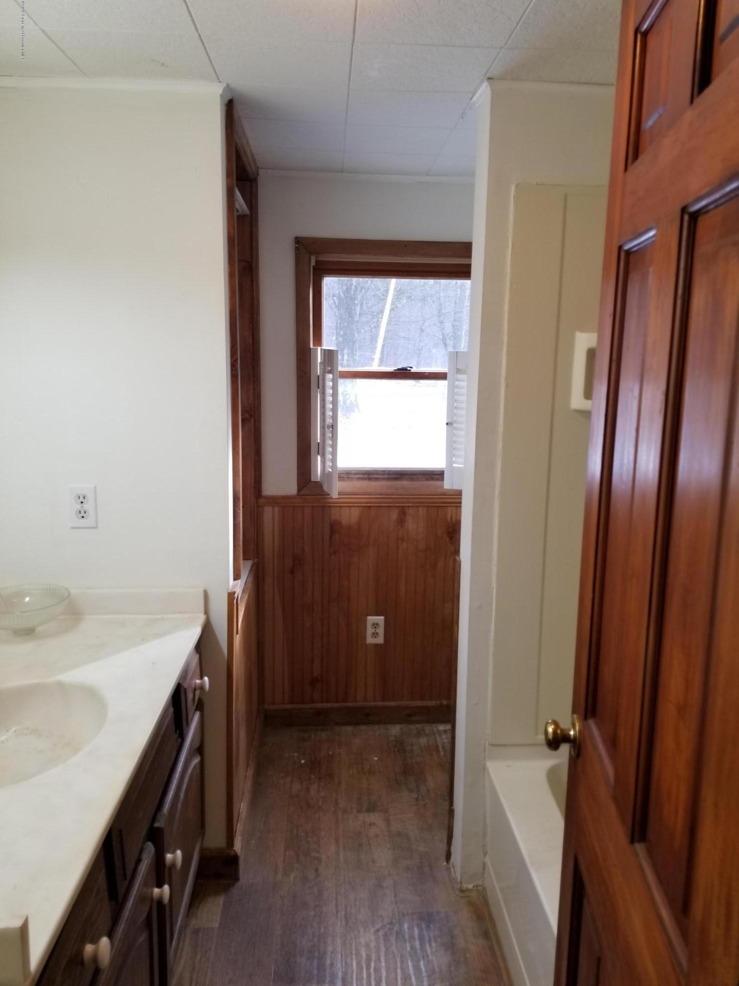 268 State Rte 4013 Little Meadows, PA 18830 - Photo 39 of 48 a bathroom with a sink a tub and a mirror