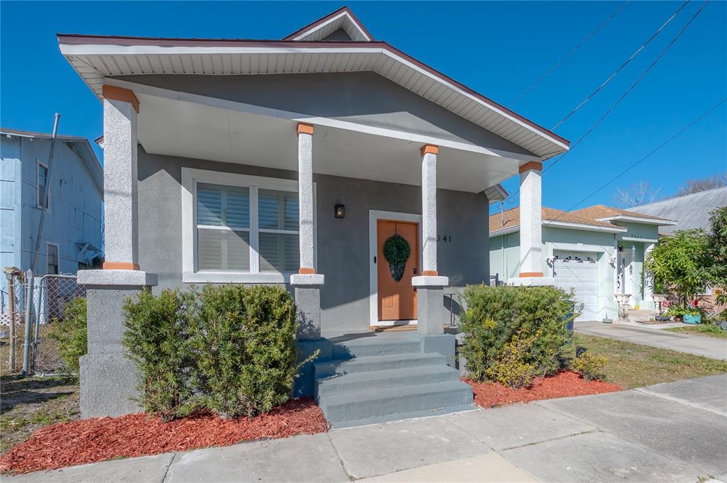 2341 West Chestnut Street Tampa, FL 33607 - Photo 2 of 42 a front view of a house with garden