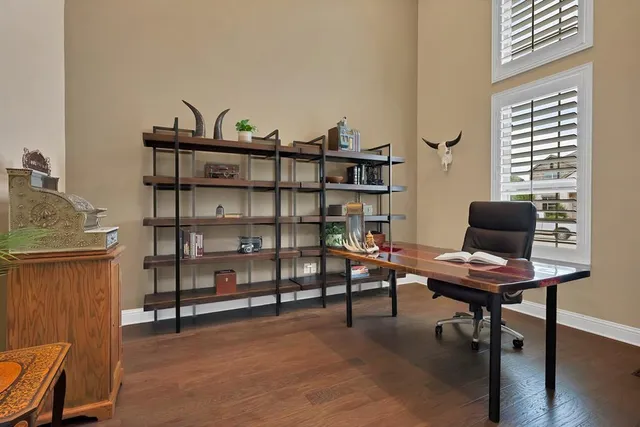 a workspace with furniture and wooden floor