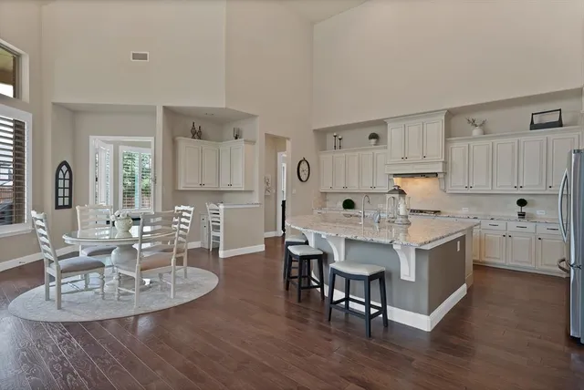 a view of kitchen with dining table and chairs