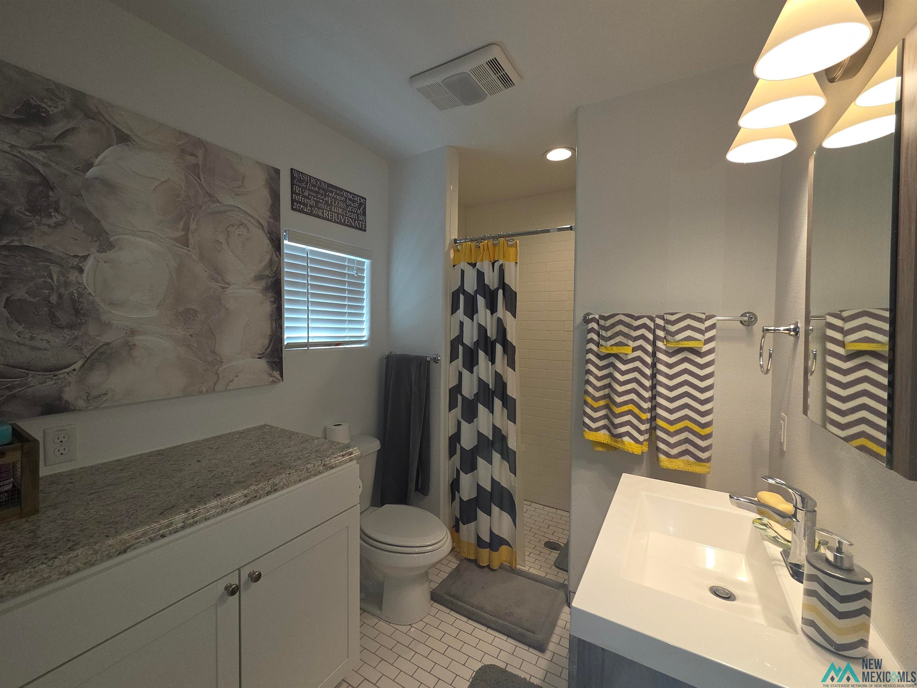 407 Bass Road Elephant Butte, NM 87935 - Photo 50 of 54 Bathroom with vanity, a shower stall, light tile patterned floors, and recessed lighting