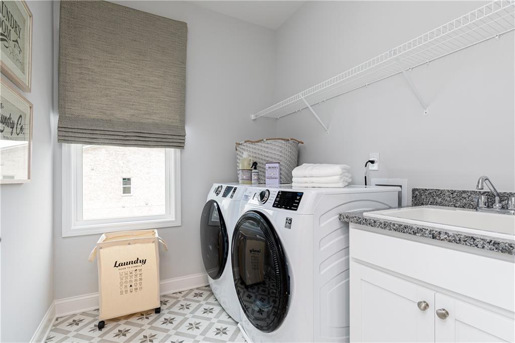 862 Leraes Way Loganville, GA 30052 - Photo 34 of 56 a utility room with dryer and washer