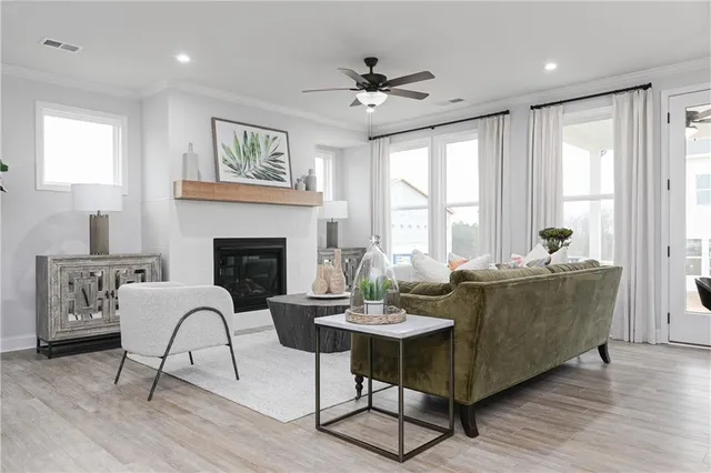 a living room with stainless steel appliances kitchen island granite countertop furniture and a view of kitchen
