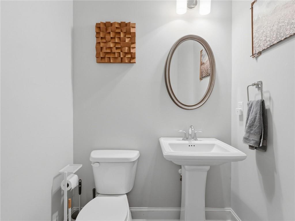 147 Fieldbrook Crossing Canton, GA 30115 - Photo 17 of 46 a bathroom with a toilet sink and mirror