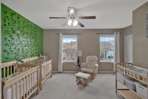 a bedroom with furniture and windows