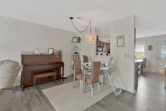a view of a livingroom with furniture and wooden floor