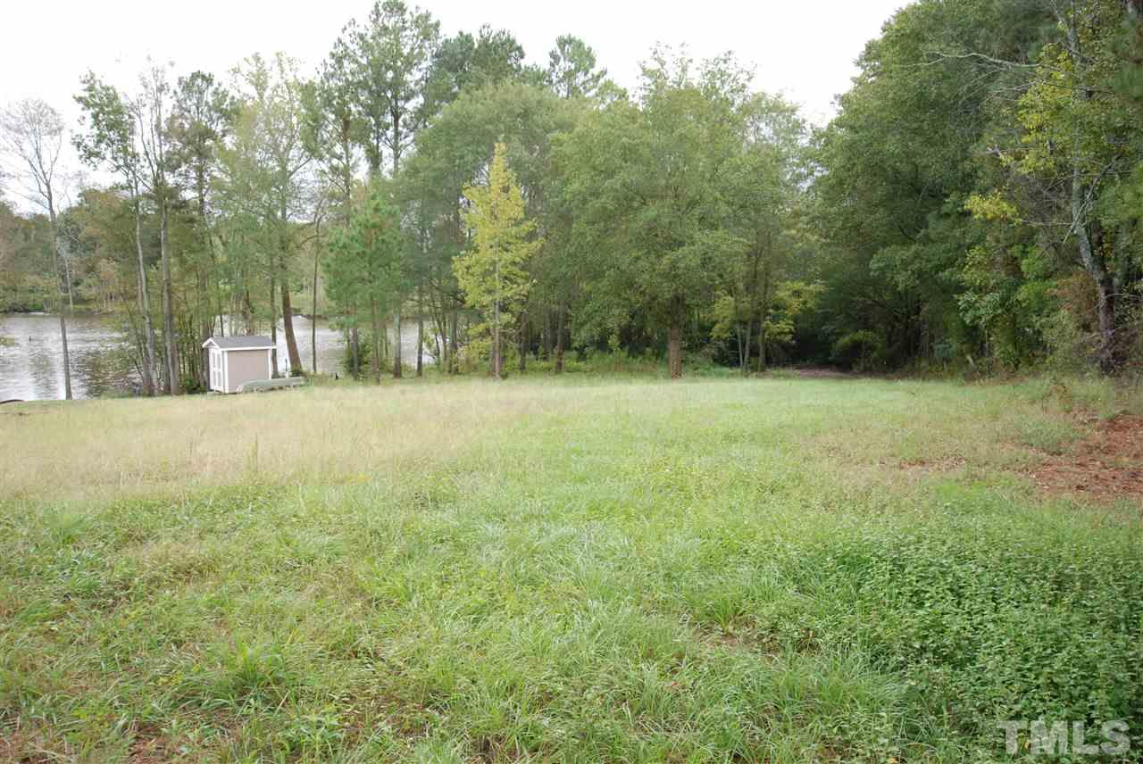 151 Massengill Pond Road Angier, NC 27501 - Photo 1 of 3 a view of a field with trees in the background