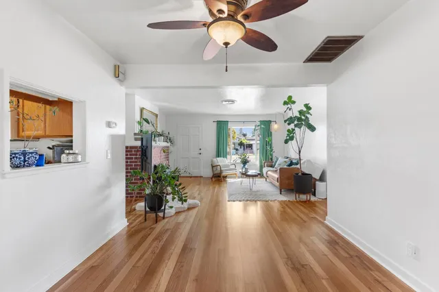 a view of a living room and hardwood floor