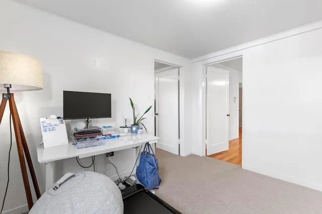 a workspace with furniture and lamp