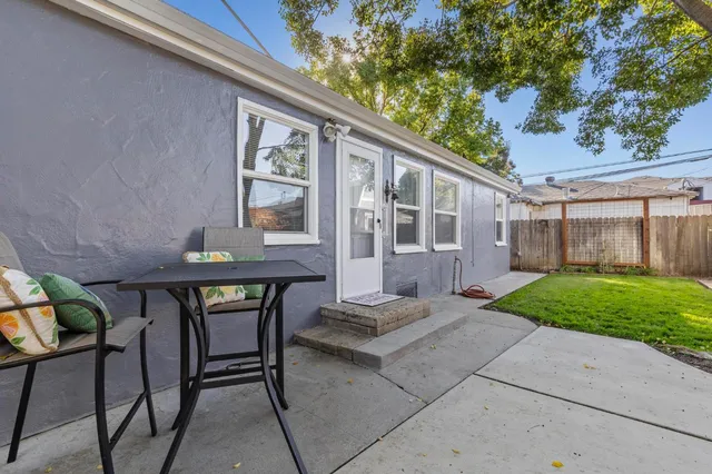 a front view of a house with garden and porch