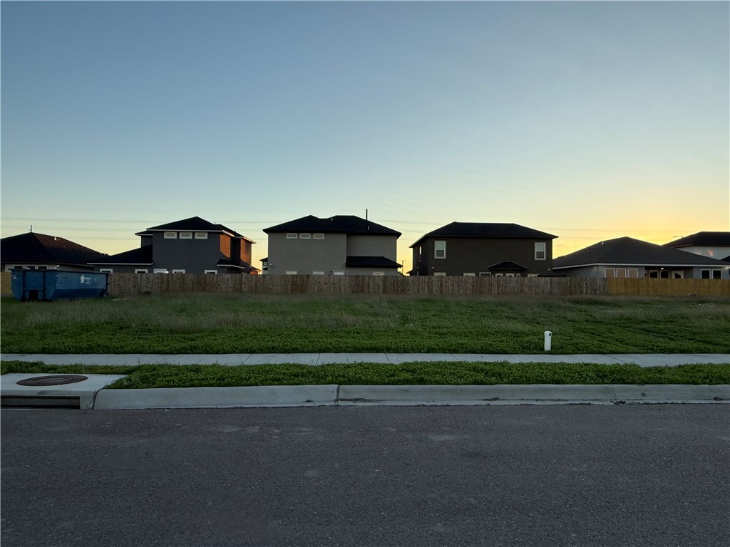 a view of street and residential houses