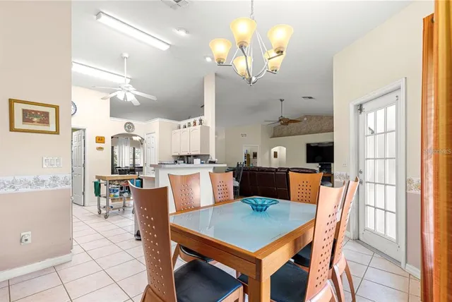 a kitchen with a table and chairs
