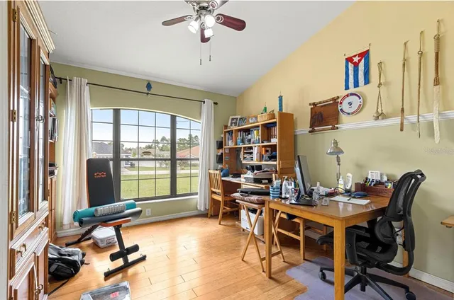 a view of a dining room with furniture and a book shelf