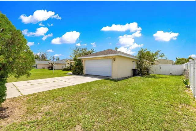 a view of living room kitchen with stainless steel appliances cabinets