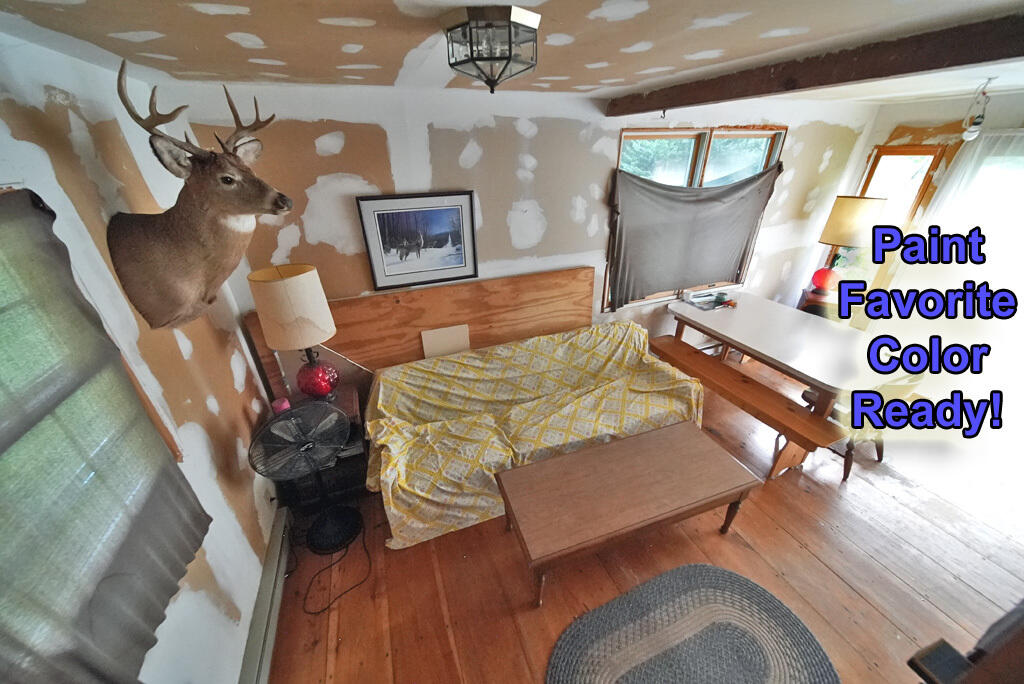 614 Shin Pond Road Patten, ME 04765 - Photo 13 of 51 living-room-patten-me